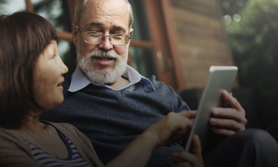 Elderly couple viewing tablet